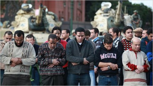 Protesters praying in Cairos Tahrir Square on Monday